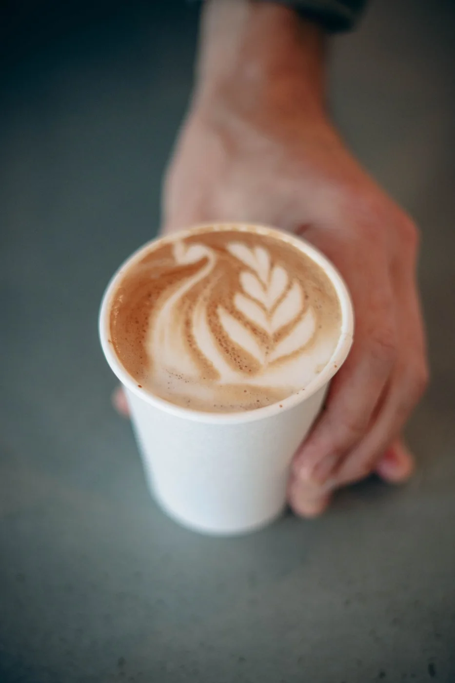 Freshly poured latte with latte art from the Luxe Latte coffee cart