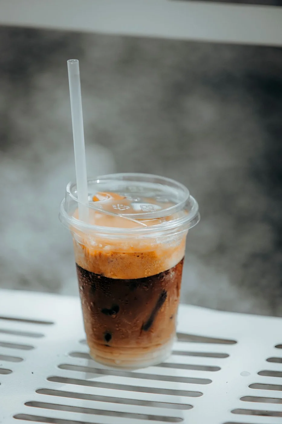 Iced latte served in a clear to-go cup, perfect for warm-weather events